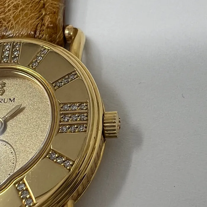 PreStyled Sets Corum Corum 18K Gold Watch with Roman Numerals and Tan Ostrich Strap