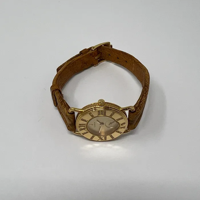 PreStyled Sets Corum Corum 18K Gold Watch with Roman Numerals and Tan Ostrich Strap