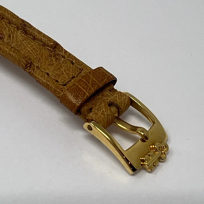 PreStyled Sets Corum Corum 18K Gold Watch with Roman Numerals and Tan Ostrich Strap