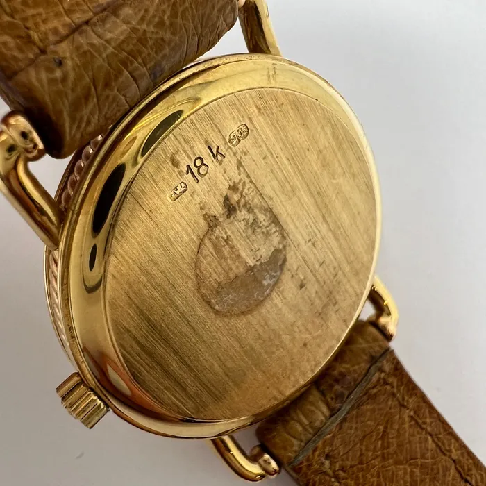 PreStyled Sets Corum Corum 18K Gold Watch with Roman Numerals and Tan Ostrich Strap